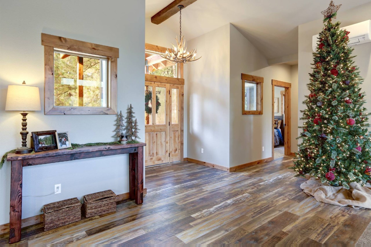 A well-decorated entryway for the holidays featuring no window coverings for sidelights or doors at Window Decor of Fairfax near Fairfax, VA