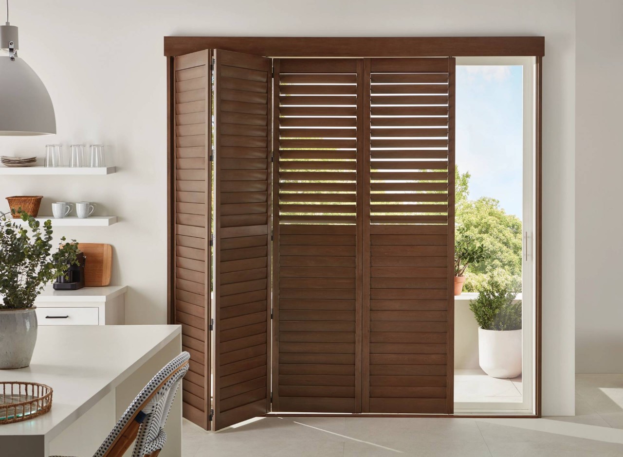 Hunter Douglas plantation shutters for sliding glass doors in a kitchen near Fairfax, VA