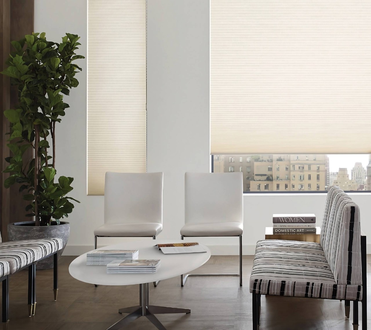 Hunter Douglas Duette® Cellular Shades on windows in a sitting area with a neutral palette at Window Decor of Fairfax near Fairfax, VA